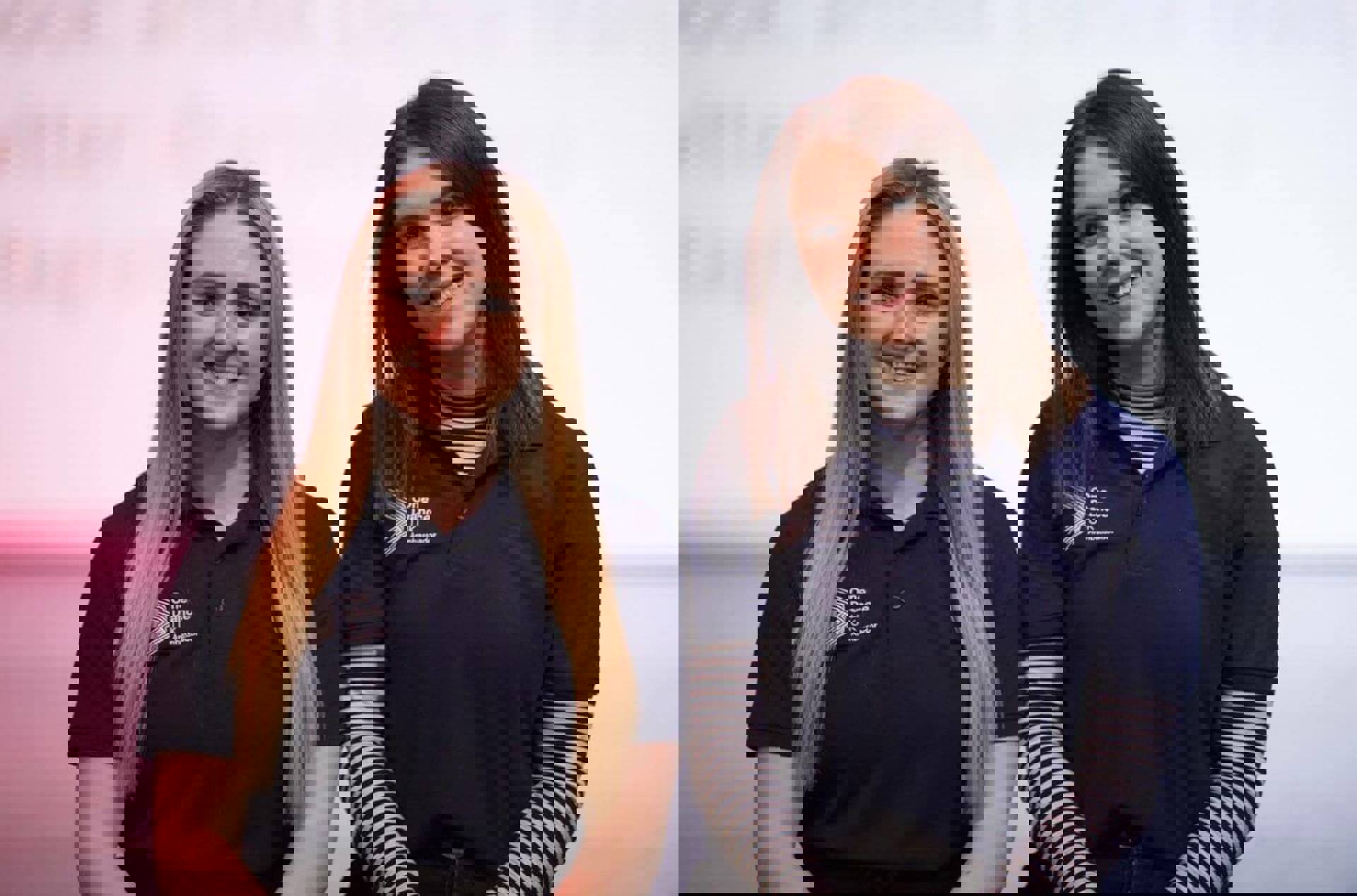 Two female One Dance UK dance ambassadors in blue t-shirts smiling at the camera