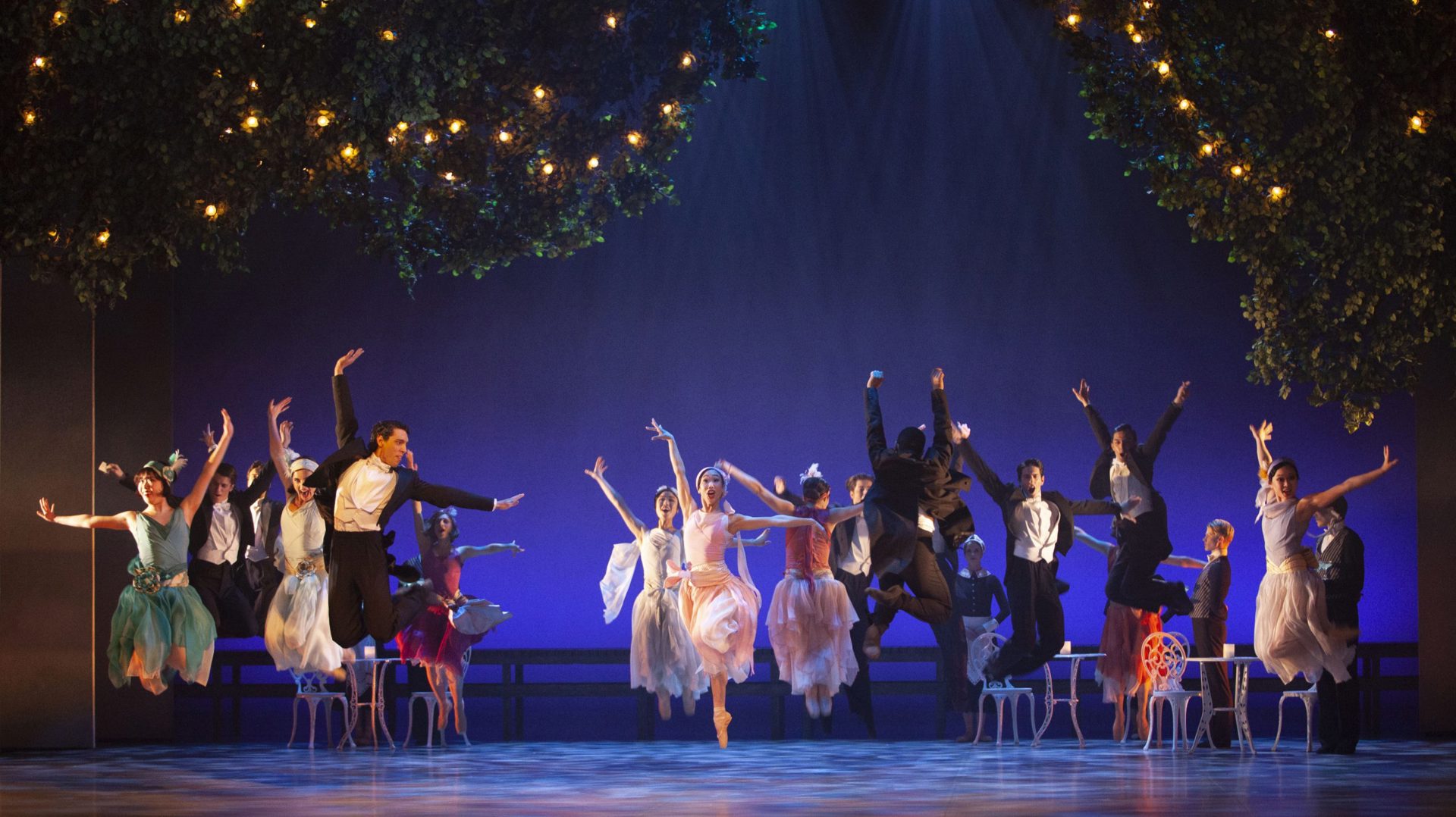 Northern Ballet Dancers on stage jumping In The Great Gatsby Northern Ballet Dancers on stage jumping In The Great Gatsby