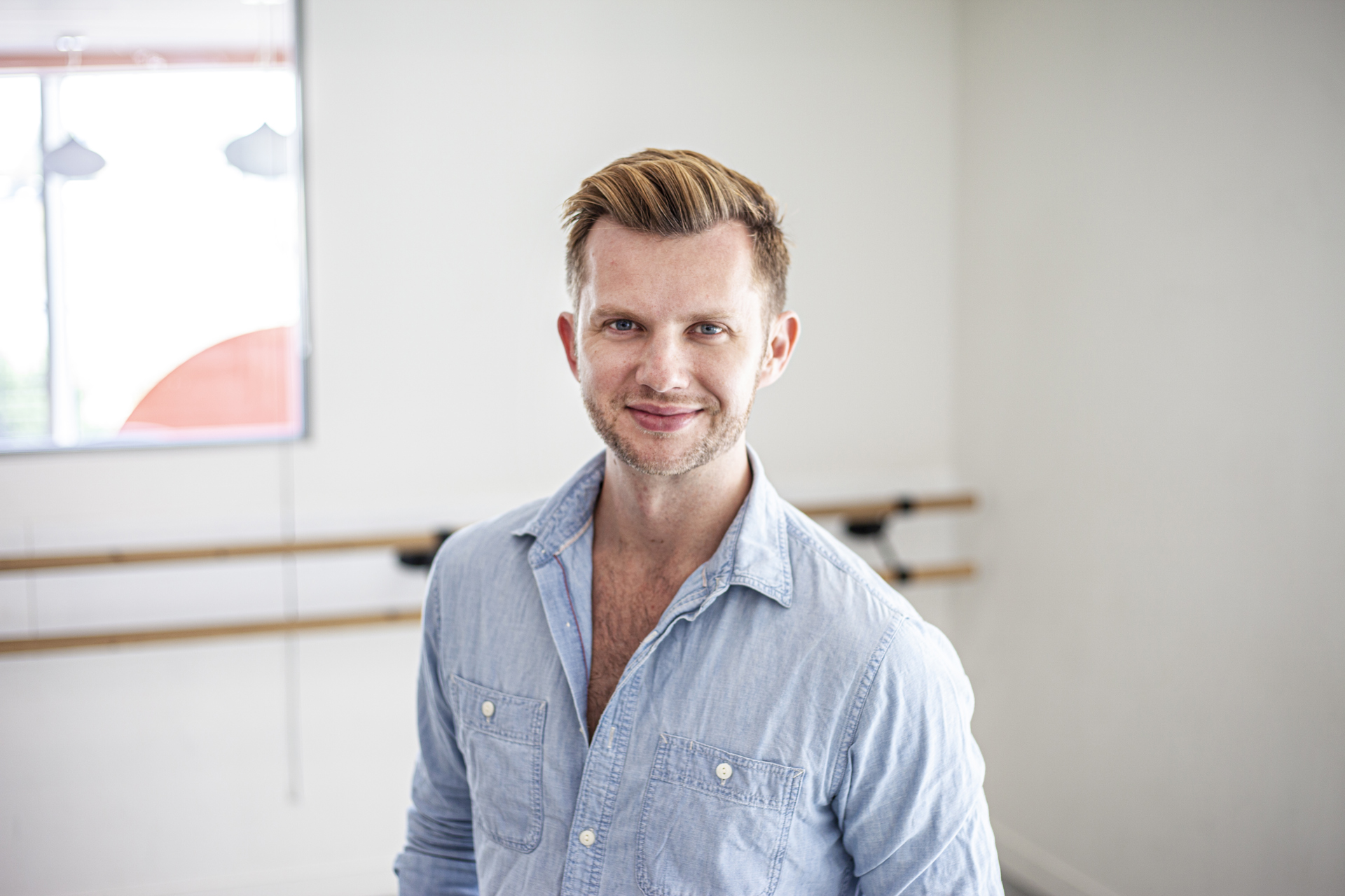 Headshot of Cameron Ball. White blonde male smiling at the camera wearing blue button up shirt Headshot of Cameron Ball. White blonde male smiling at the camera wearing blue button up shirt