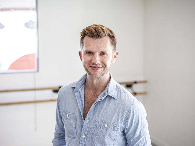 Headshot of Cameron Ball. White blonde male smiling at the camera wearing blue button up shirt Headshot of Cameron Ball. White blonde male smiling at the camera wearing blue button up shirt