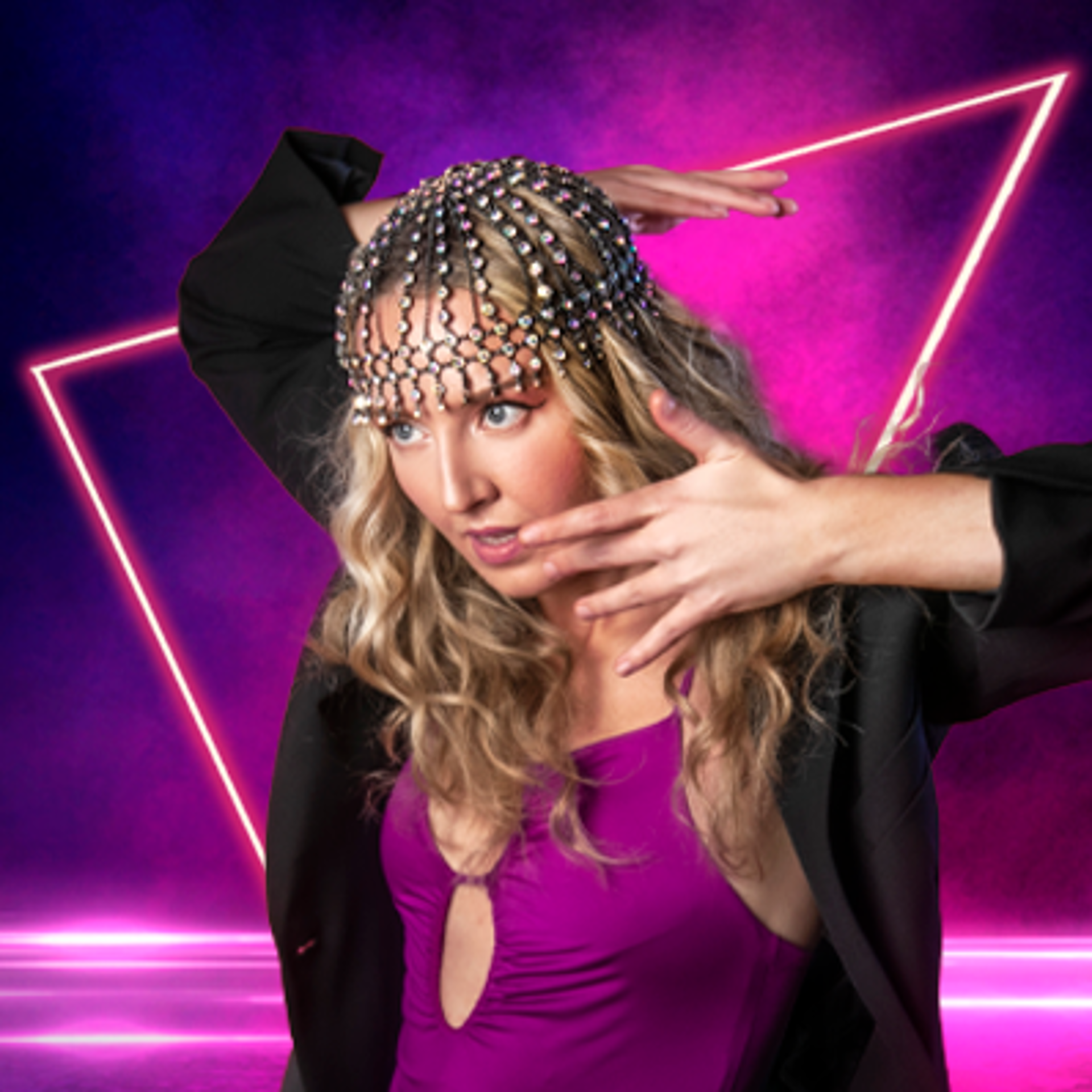 contemporary  dancer looking up to the top left of the image holding her face with one arm behind her head on hot pink background. White, long curly blonde haired female wearing black trousers, purple leotard, black blazer and a diamond head cap. 