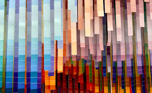 lots of blue and orange colour charts hanging 